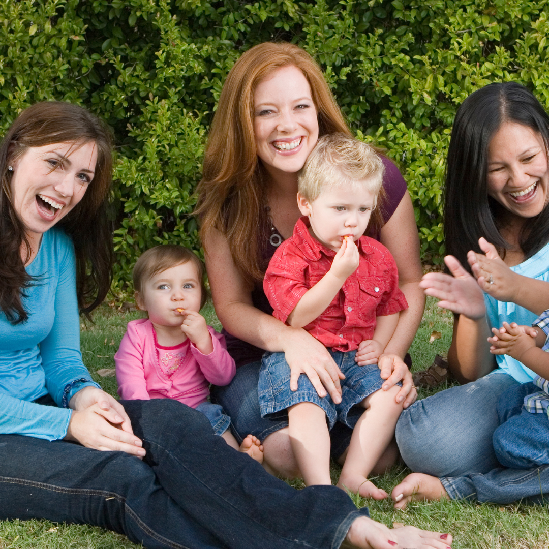 women and children hanging out with their children