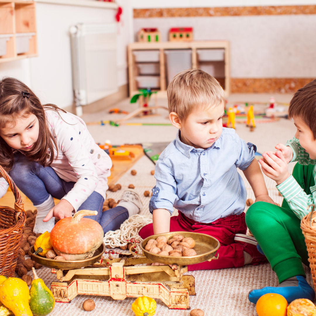 kids playing with toys sitting on the floor